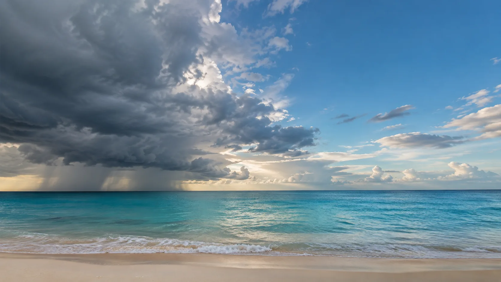 Caribbean coastline in the Riviera Maya under a wide sky with scattered clouds